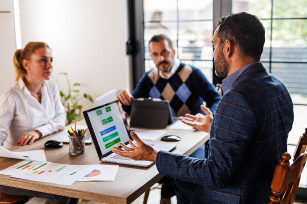 istock Business associates discussing strategies when collaborating on a mutual project 1567218405