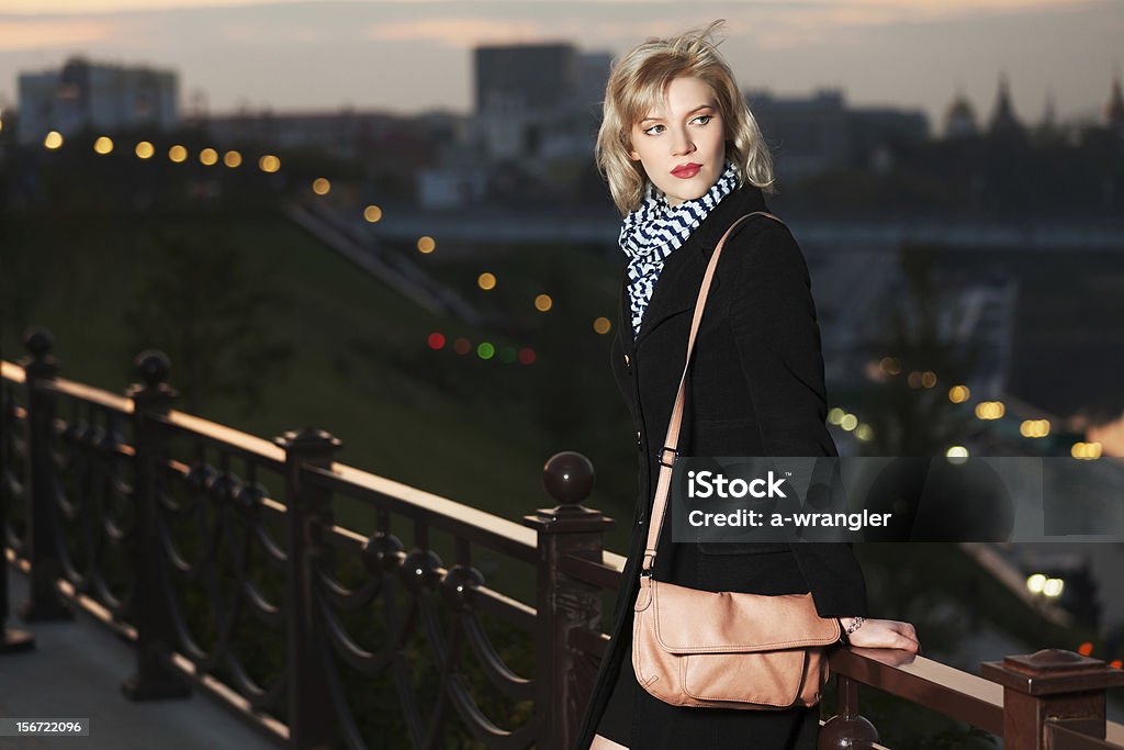 Young woman on the night city street Adult Stock Photo