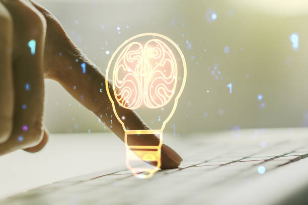 istock Creative idea concept with light bulb and human brain illustration and with hands typing on laptop on background. Neural networks and machine learning concept. Multiexposure 1567221675