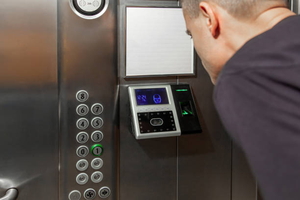 istock A man shows his face to a fingerprint access control terminal with a facial recognition function installed in the elevator 1567229928