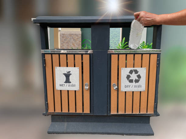 istock Asian old woman throwing bottles into the trash, recycling bin, sorting and throwing things in appropriate trash 1567241795