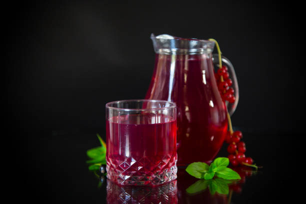 istock Cold refreshing drink from fresh summer berries in a decanter. 1567244053