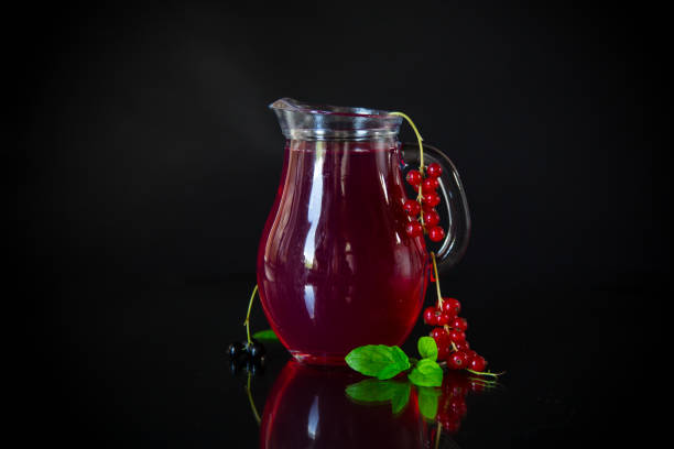 istock Cold refreshing drink from fresh summer berries in a decanter. 1567244573