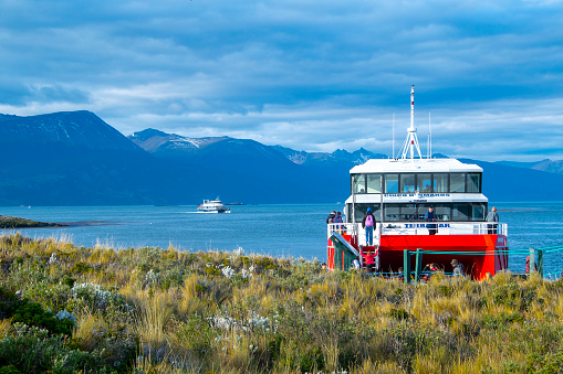 Ushuaia, Argentina - April 15, 2022: Ship trip excursion arrving to one of the islands at beagle channel, ushuaia, argentina tierra del fuego, argentina