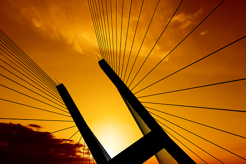 suspension bridge tower in close-up silhouette at sunset (XXL)