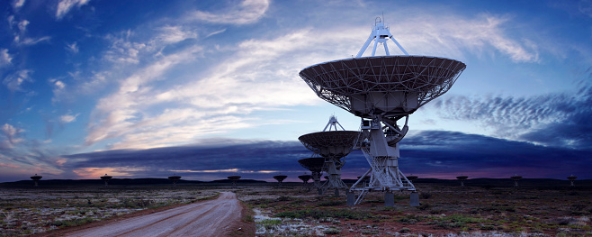 giant radio telescope satellite dishes at twilight, panoramic frame (XL)