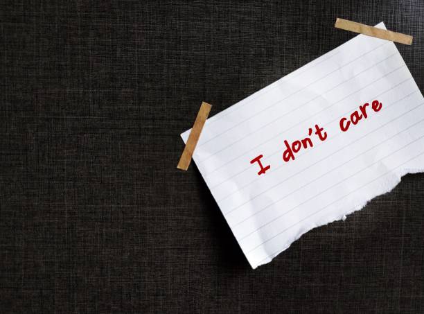 istock On copy space black background, torn paper with handwritten text I DON'T CARE , to express feeling of it's not important or So what? - should not be considered objectionable 1567262381