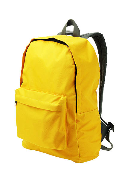 A bright yellow backpack with white backpack  Yellow Backpack Standing on White Background strap photos stock pictures, royalty-free photos & images