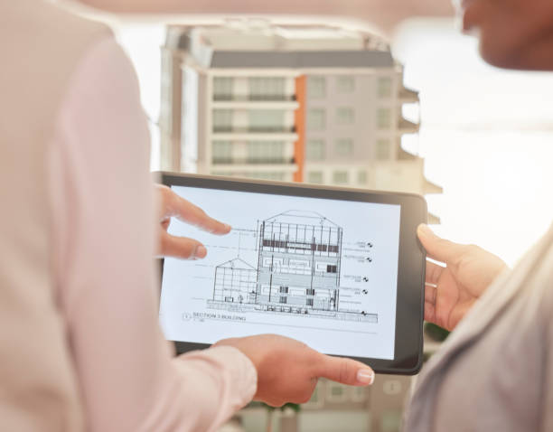 istock Architect, hands and tablet in construction planning, 3D model or design strategy for industrial architecture at office. Hand of engineering team in meeting on touchscreen for blueprint building plan 1567268470