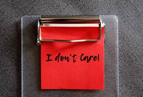 istock Red note with text written I DON'T CARE indicates speaker writer has no interest or emotional investment in topic - it doesn't matter , or self reminder to stop caring what others think 1567269071