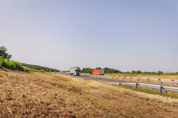 istock Cars and trucks on highway 1567283422