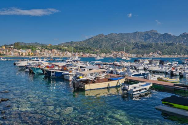 istock small boat harbor, marina in Giardini Naxos, Sicily 1567285649