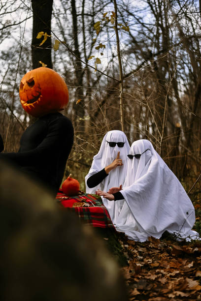 istock halloween pumpkins and ghosts tea party in the forest 1567288611