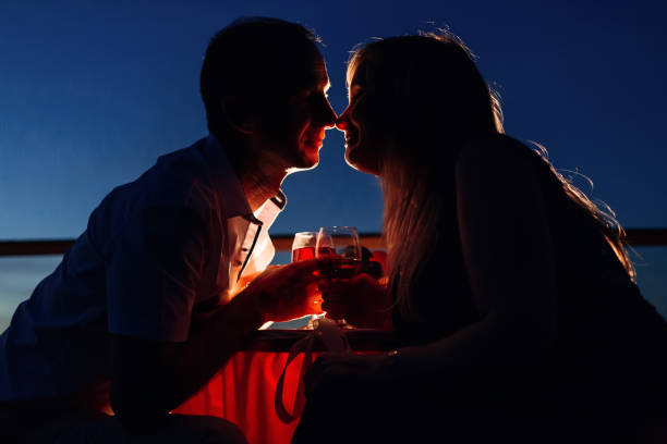 istock lovers enjoy each other on a romantic date and drink wine 1567300790