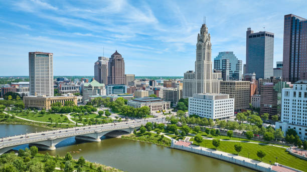 istock Aerial Columbus Ohio with bright blue sky with clouds and bridge over Scioto river 1567308130
