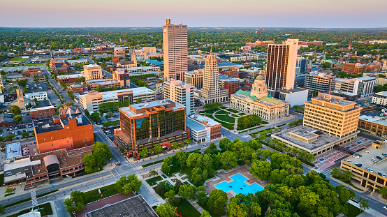 Image of Aerial downtown Fort Wayne city of churches sunrise Freimann Square, Court House skyscraper fountain