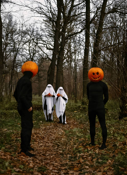 istock halloween pumpkins and ghosts in the forest 1567312037