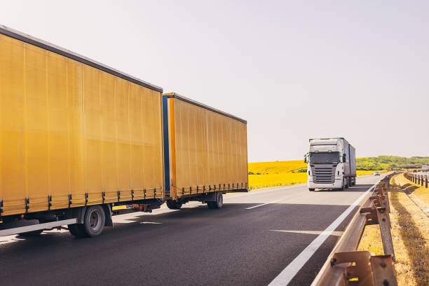 istock Cars and trucks on highway 1567312569