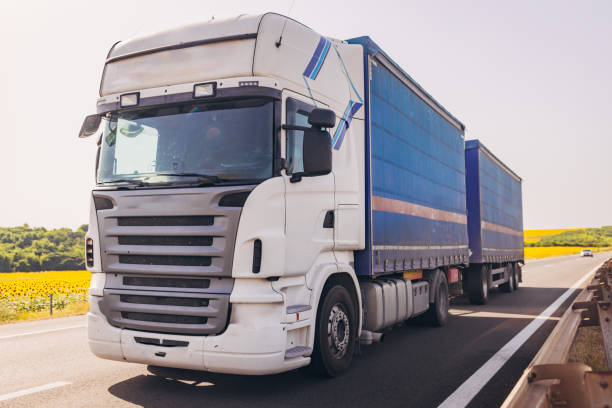 istock Cars and trucks on highway 1567315288