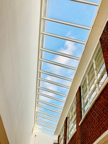 Natural light from skylights against blue sky