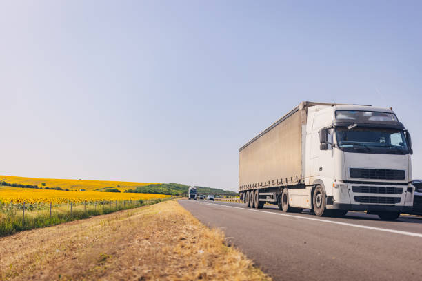 istock Cars and trucks on highway 1567321181