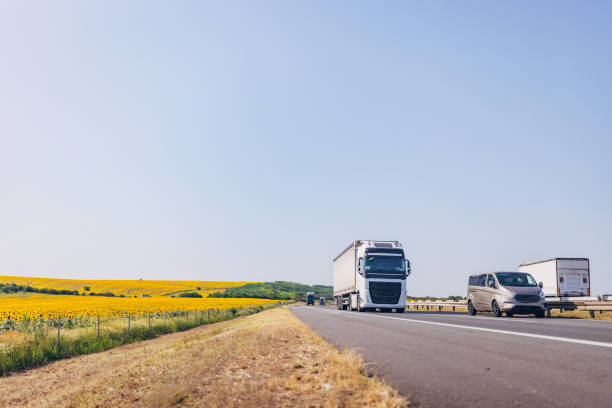 istock Cars and trucks on highway 1567323521