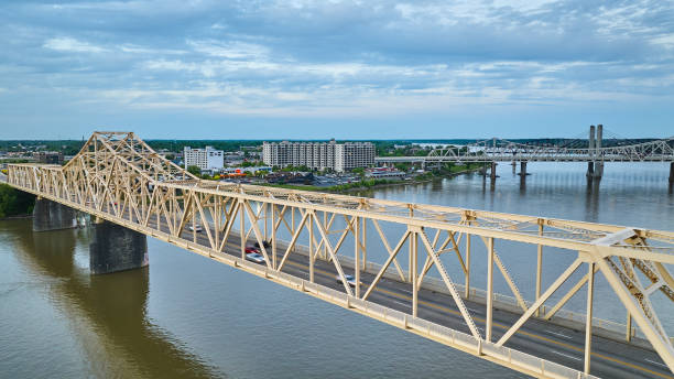 istock Aerial white gold truss bridge stretching across large river Ohio River 1567323605