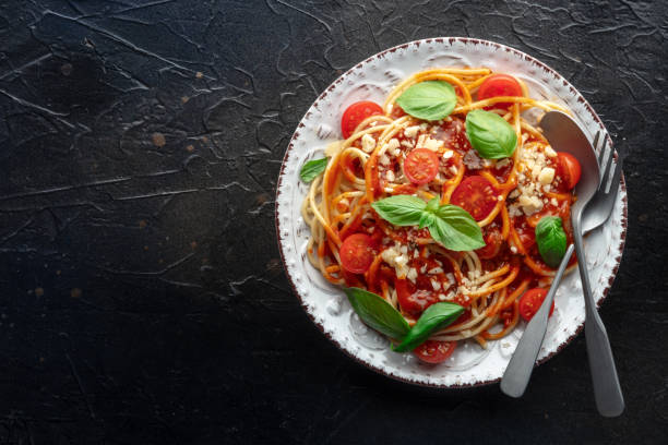 istock Spaghetti marinara, pasta with tomato sauce and basil, shot from above 1567324205