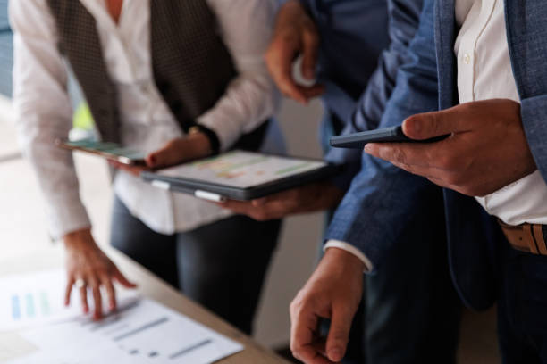 istock Business people analyzing data on digital tablet and smart phones 1567328131