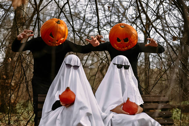 istock halloween pumpkins and ghosts in the forest 1567329254