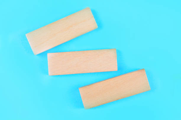 Empty wooden blocks on a blue background stock photo
