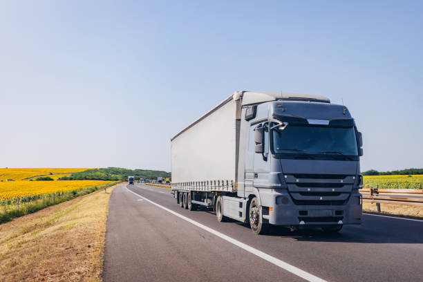 istock Cars and trucks on highway 1567334747