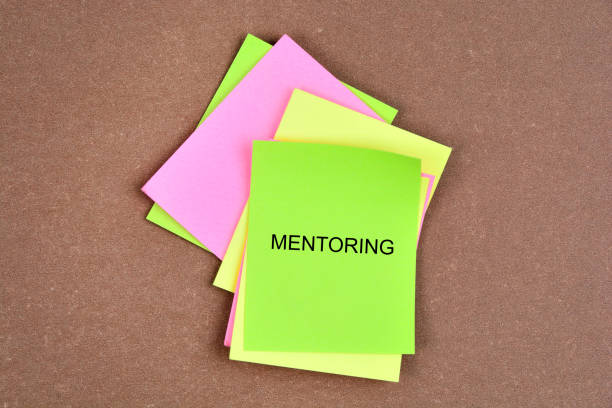 Mentoring word on colorful notes stock photo