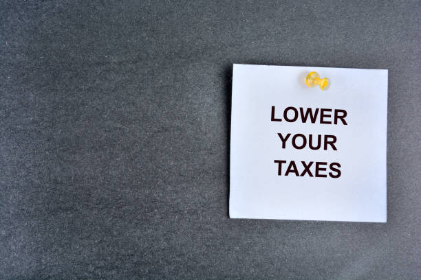 istock Lower your taxes words on a note paper 1567335864