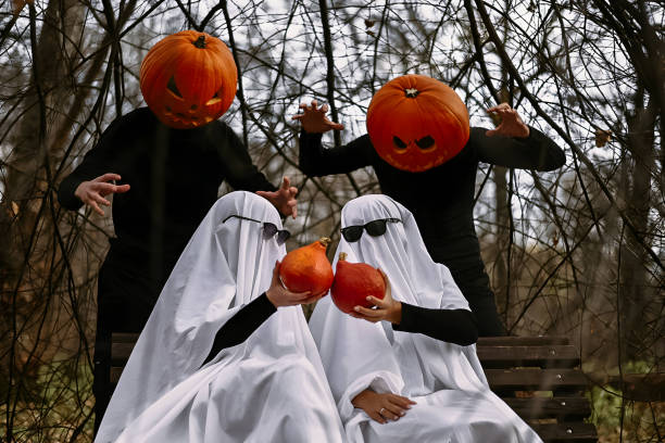 istock halloween pumpkins and ghosts in the forest 1567343886