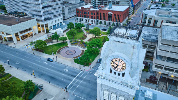 istock Clocktower at sunset sunrise aerial with green courtyard 1567343890