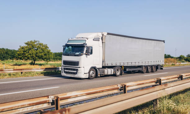 istock Cars and trucks on highway 1567354351