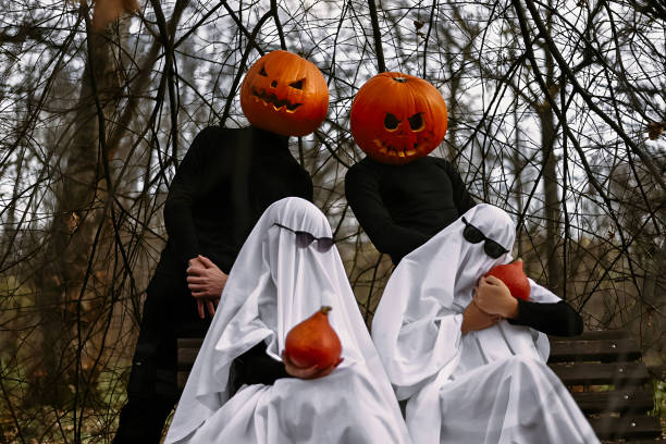 istock halloween pumpkins and ghosts in the forest 1567354878