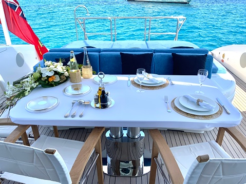 This shot shows a beautifully arranged table on a yacht.
