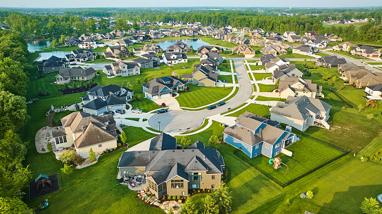 Image of Cul-de-sac large neighborhood rich homes mini mansions million-dollar dwellings with ponds aerial