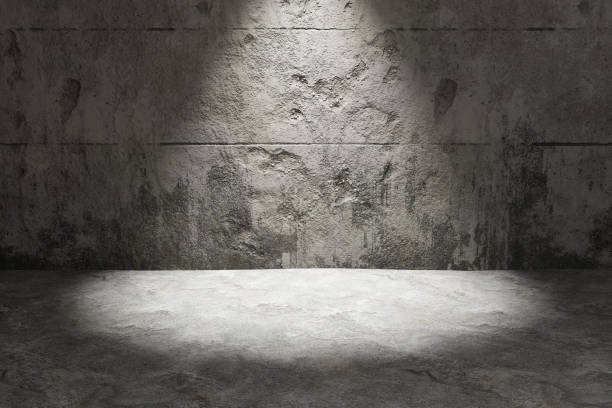 istock Spotlight shining on concrete wall plates and floor. Illustration as design element for website template and slide show presentation background 1567360490