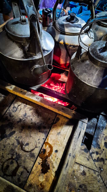 istock Using a charcoal stove to mix coffee 1567363368
