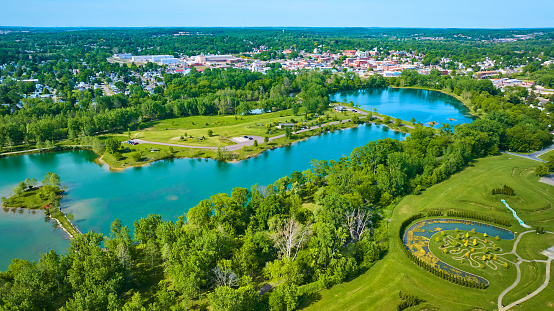Image of Distant city of Mount Vernon Ohio in aerial of large lake and island at Ariel Foundation Park trails