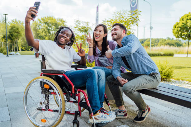 istock Cheerful friends taking selfies outdoors 1567373902