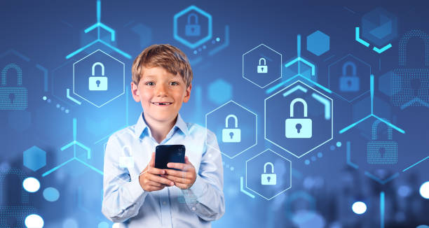 istock Smiling boy with smartphone in city, cybersecurity interface 1567375601