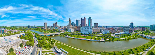 istock Downtown Columbus Ohio panorama aerial with full downtown skyscraper view and both river banks 1567377970