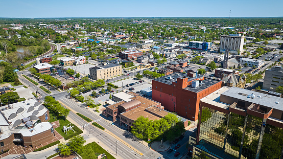 Image of Downtown parking lots, businesses, buildings, housing, churches, architecture aerial