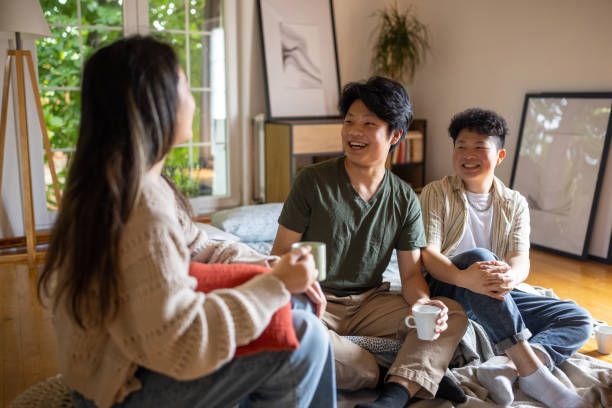 istock Three friends talking in the bedroom 1567381610