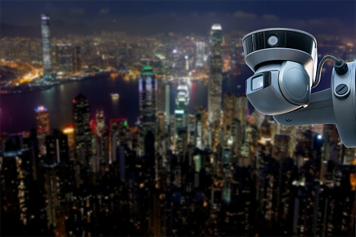 CCTV monitoring, security cameras. Backdrop with views of the city during twilight