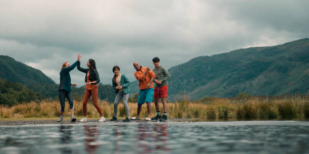 istock Family Skipping Stones Together 1567391370